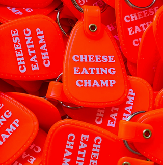 Cheese Eating Champ Saddle Keychain