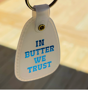 In Butter We Trust Saddle Keychain - Glow In the Dark