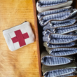 Load image into Gallery viewer, Mini First Aid Zipper Pouch - Red Swiss Cross on Cream
